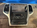 2011,2012,2013 Jeep Grand Cherokee Radio Bezel Dash Trim With Climate Control. Fixed Price $125.00.