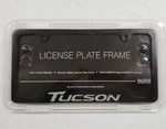 New 2005-2025 Hyundai Tucson Black License Plate Frame, Oem. Fixed Price $49.95.